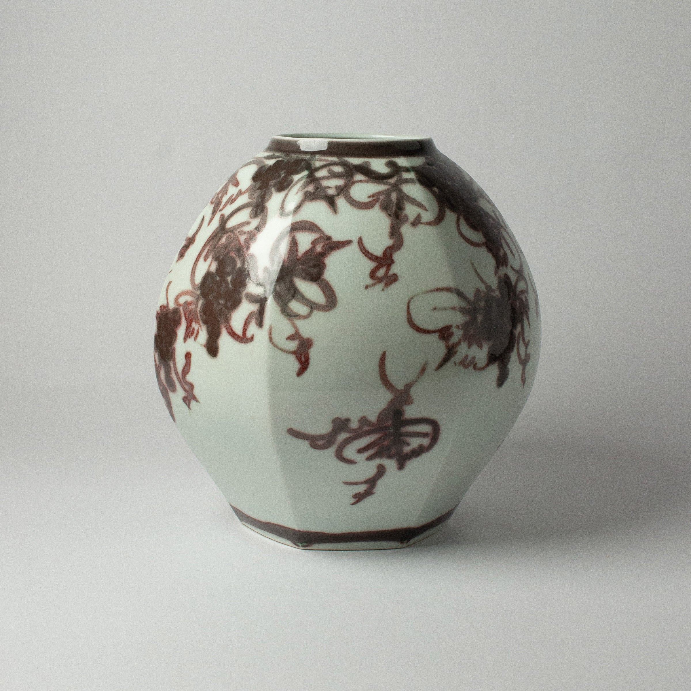 White porcelain vase with grape motifs by Kondō Hiroshi