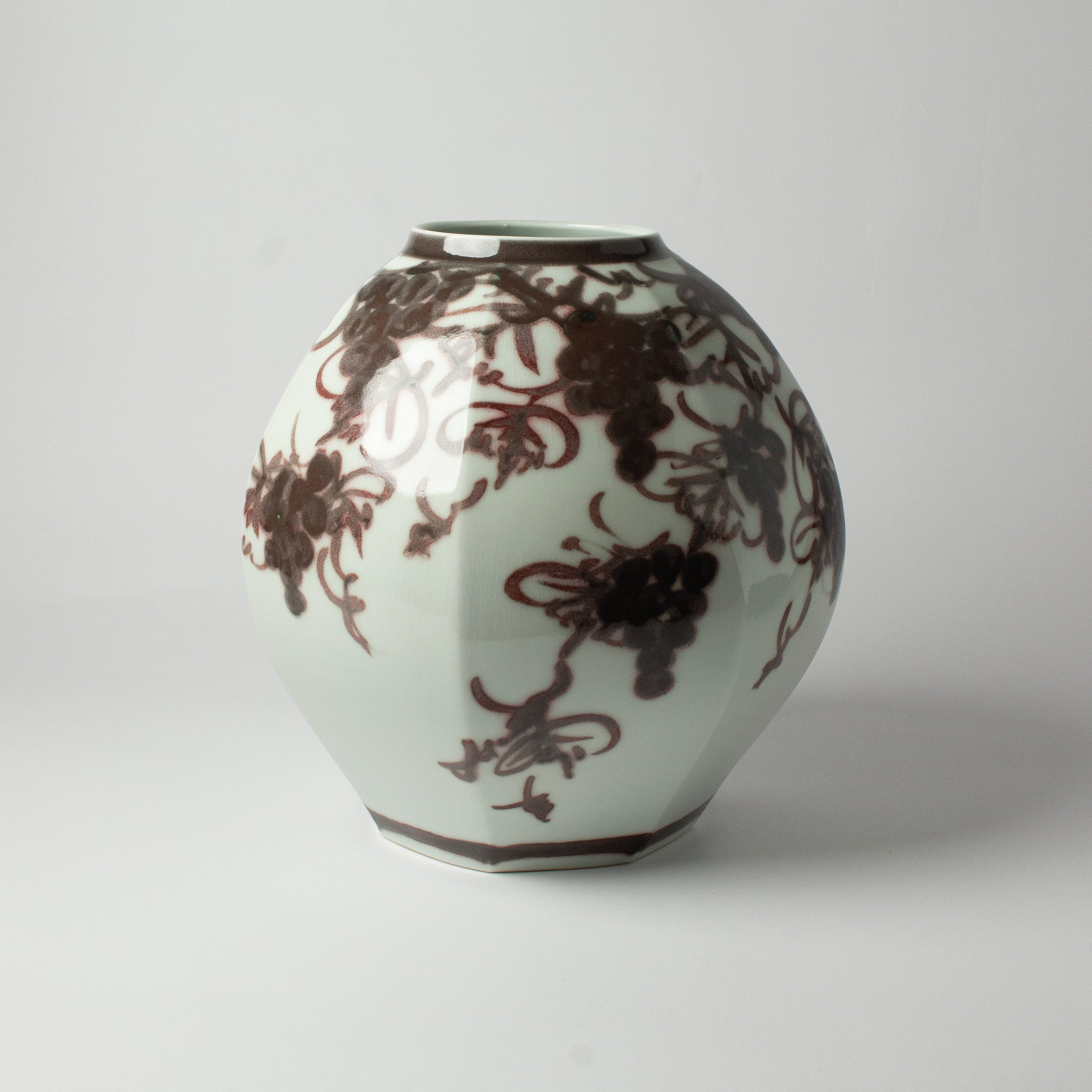 White porcelain vase with grape motifs by Kondō Hiroshi