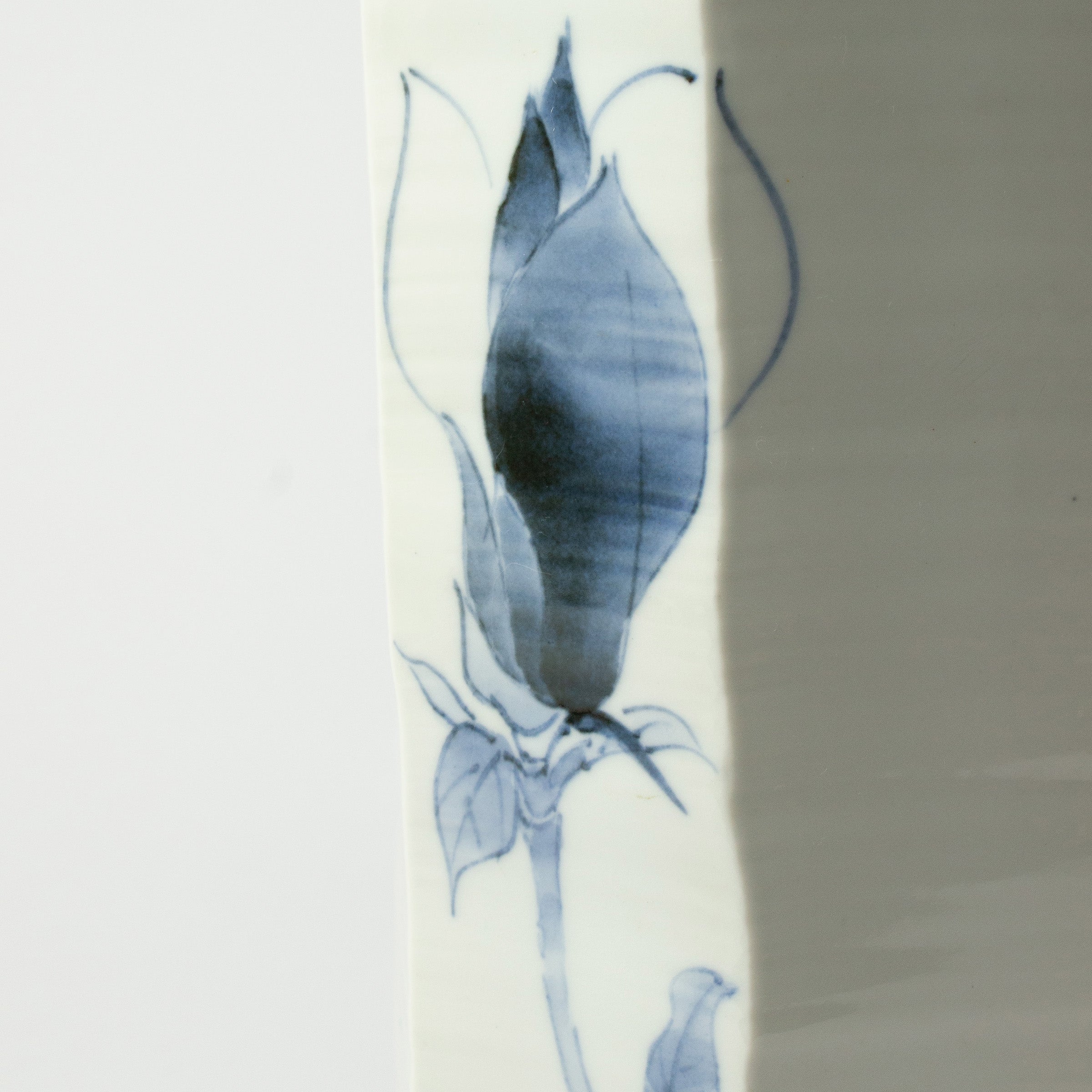 White porcelain vase with blue magnolias by Tetsuya Ueda