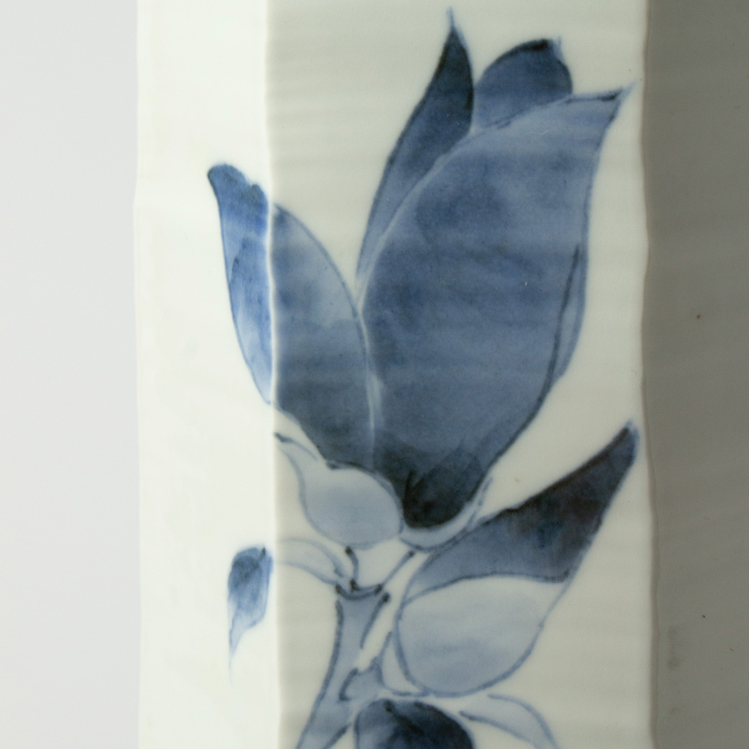 White porcelain vase with blue magnolias by Tetsuya Ueda