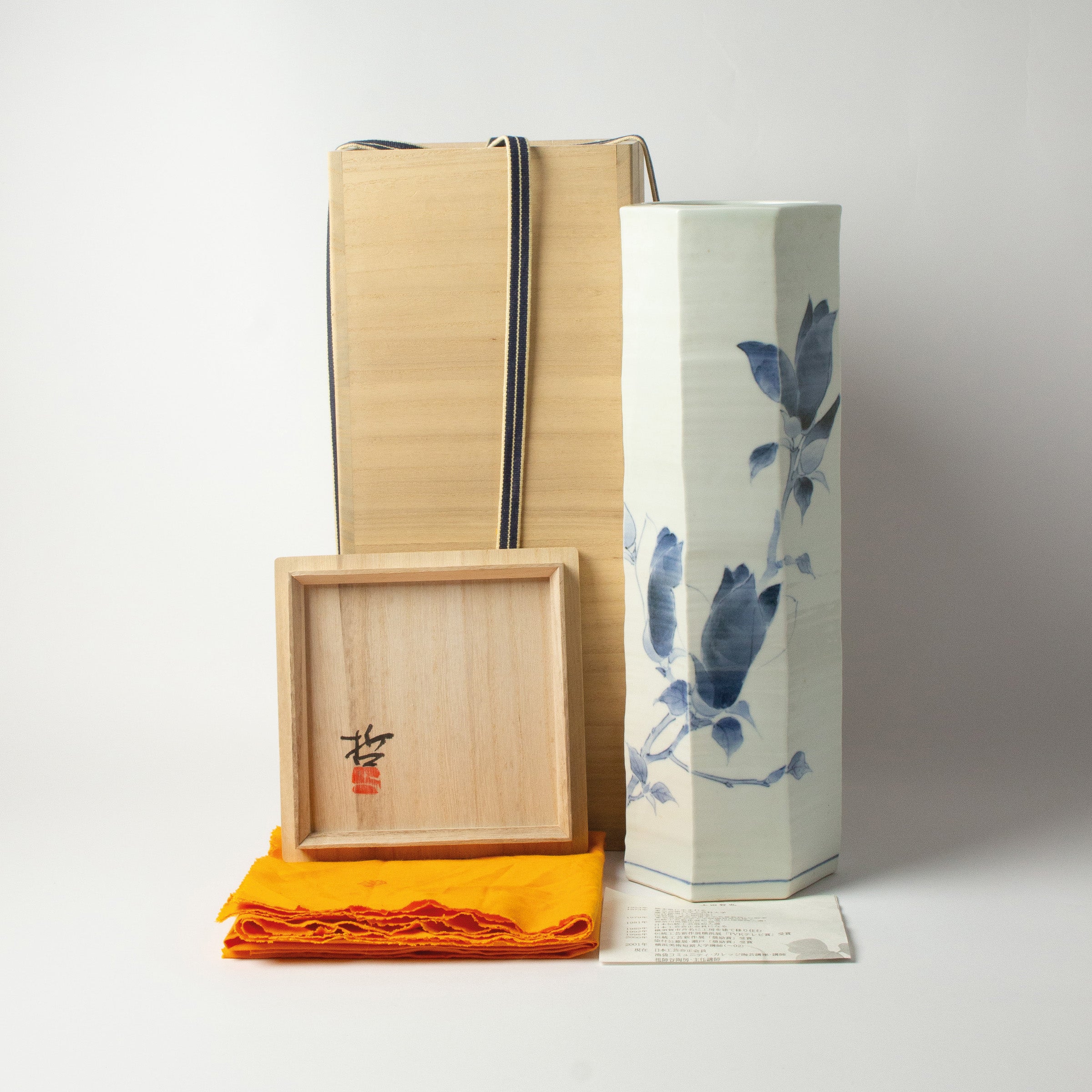 White porcelain vase with blue magnolias by Tetsuya Ueda