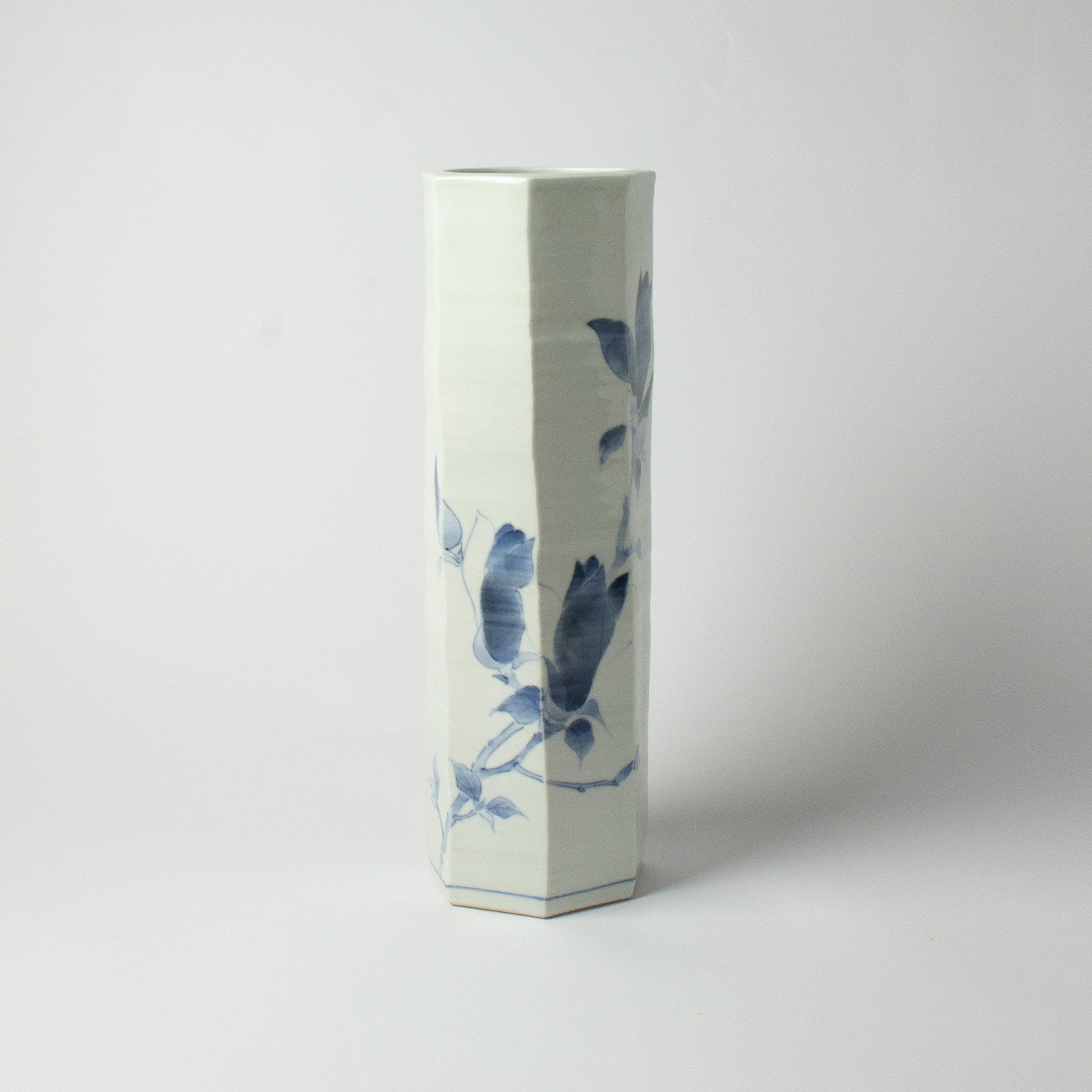 White porcelain vase with blue magnolias by Tetsuya Ueda