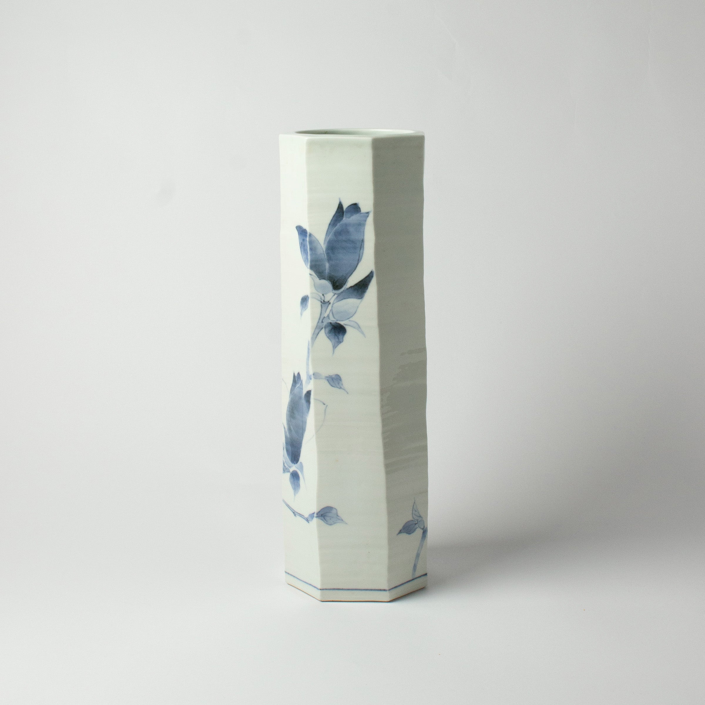 White porcelain vase with blue magnolias by Tetsuya Ueda