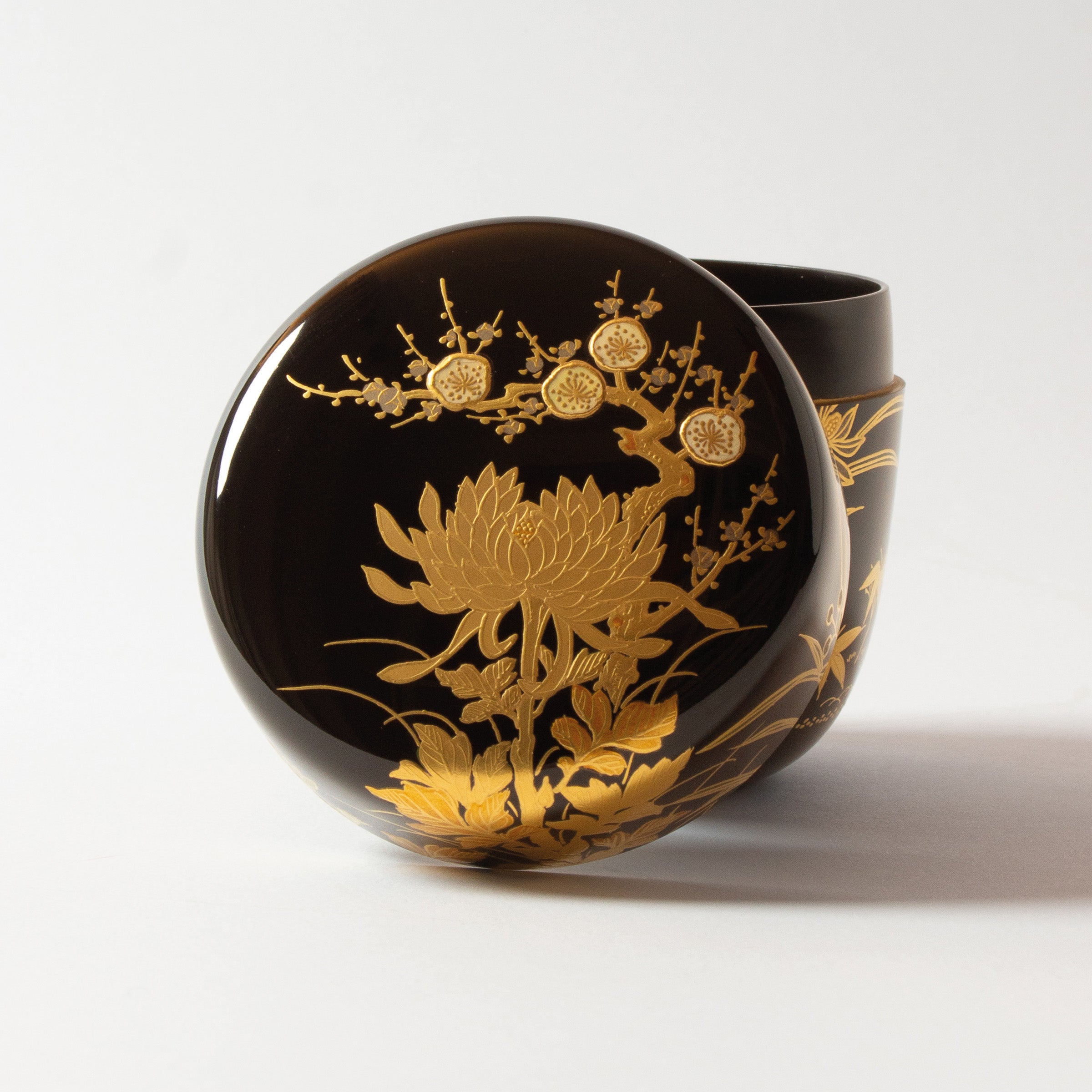 Natsume (tea caddy) Japanese urushi lacquer and gold powder maki-e decoration, botan (peony) and ume (plum blossom) decor