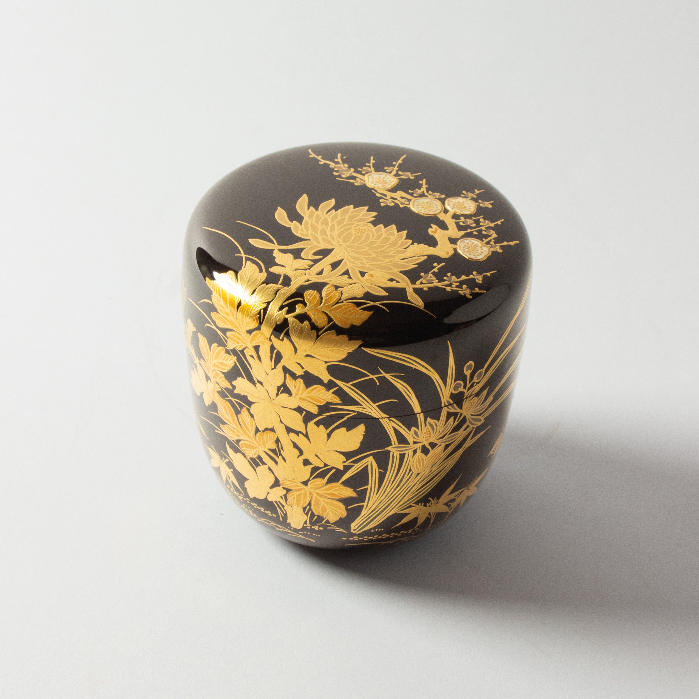 Natsume (tea caddy) Japanese urushi lacquer and gold powder maki-e decoration, botan (peony) and ume (plum blossom) decor